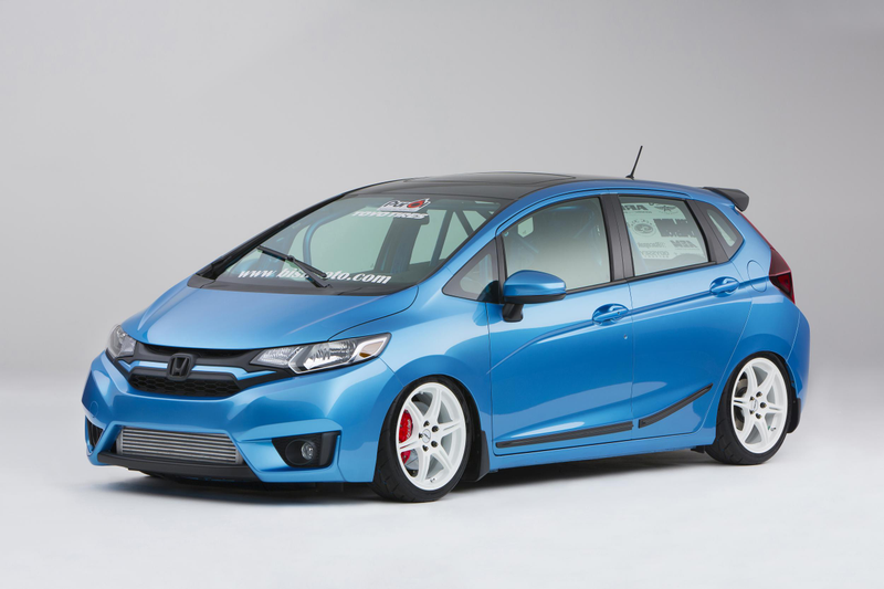 Illustration for article titled A Honda Fit With A Grom In The Back Is Something We Need Yesterday